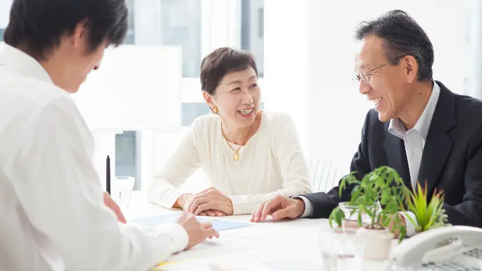 Business professionals analyzing data on a large screen